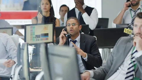 4K Financial traders watching the world markets react as the market crashes Stock Footage 72275150