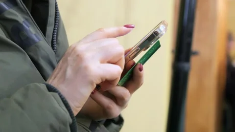 4K Finger of woman touching scroll page app on mobile phone. Browsing movie Stock Footage 275501702