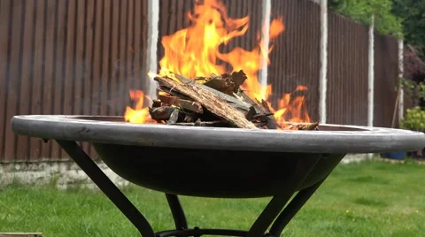 4k fire pit close up side view in the garden at summer time Stock Footage 51101445