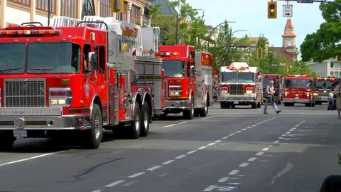 4K Fire Trucks Slow Motion Parade Line of Red Firetruck Engines Stock Footage 78646536