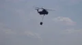 4k Firefighting helicopter with water bag fly by close up at airshow exhibition 4k or 4k+ Resolution