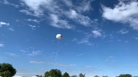 4k first aid station indicator balloon, flying in the sky Stock Footage 152736697