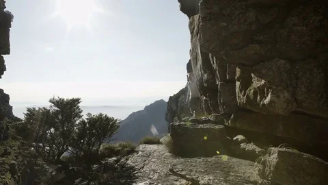 4K Fit & active couple climbing rocky hill top & looking out at the view Stock Footage