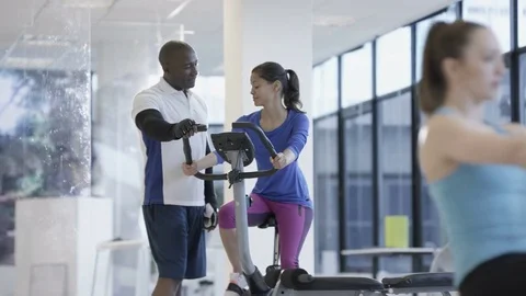4K Fit group working out in the gym, video screen showing moving outdoor scene Video stock 75870577