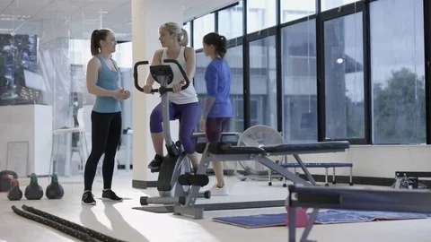 4K Fit group working out in the gym, video screen showing moving outdoor scene Stock Footage 75872655