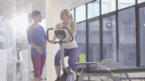 4K Fit group working out in the gym, video screen showing moving outdoor scene Stock Footage 75911602
