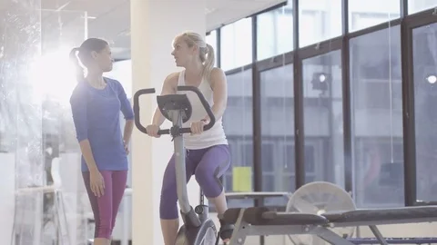 4K Fit group working out in the gym, video screen showing moving outdoor scene Stock Footage 75911806
