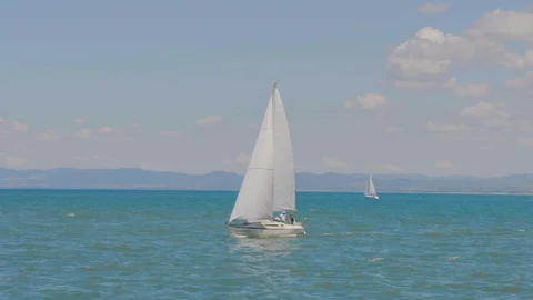 4K Fiumicino Italy coast sail boat daytime Stock Footage