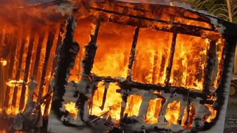 4K Flames rising as a small building is destroyed by a large fire. Slow motion Stock Footage 232337421