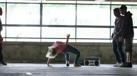 4K Flexible breakdancer shows her moves, shot on Red Epic Dragon Stock Footage 54761707