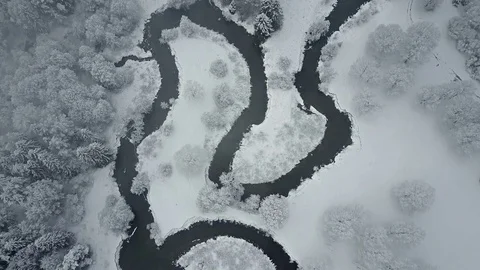 4K. Flight above clouds and wild winding river in winter forest. Aerial view. 動画素材 83340477