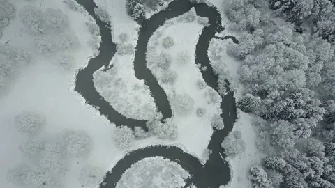4K. Flight above clouds and wild winding river in frozen forest. Aerial. Video stock 97964427