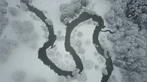 4K. Flight above clouds and wild winding river in frozen forest. Aerial. Video stock 97964886