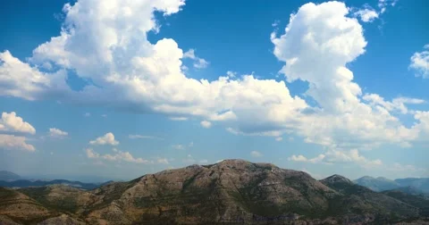 4K - Flight along mountains with clouds Stock Footage 65467634
