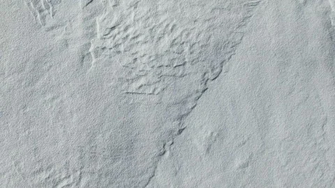 4K. Flight and takeoff above snow fields in winter, aerial top view. Video stock 99374023