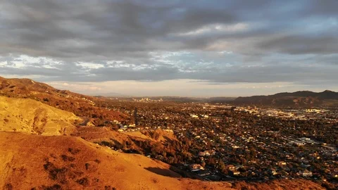 4K flight over burbank mountains, looking at city, skyline with dramatic sky Stock Footage 119396705
