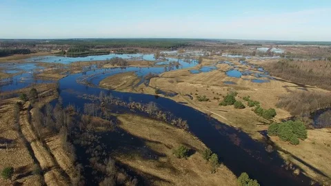 4K. Flight over flooded blue river in spring, aerial panoramic view. Stock Footage 73800517