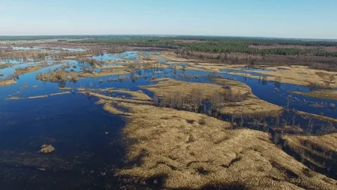 4K. Flight over flooded blue river in spring, aerial panoramic view. 動画素材 73801178