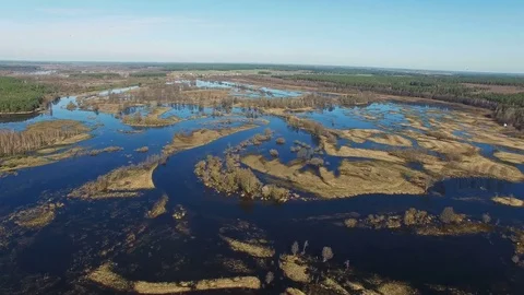 4K. Flight over flooded blue river in spring, aerial panoramic view. Stock Footage 73801568
