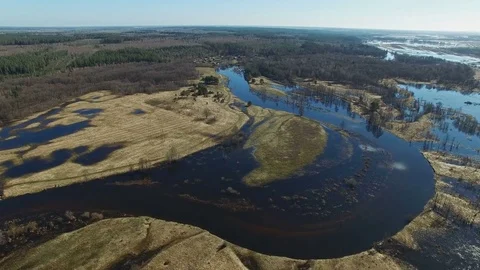4K. Flight over flooded blue river in spring, aerial panoramic view. Stock Footage 73802218