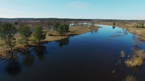 4K. Flight over flooded blue river in spring, aerial panoramic view. 動画素材 73802502