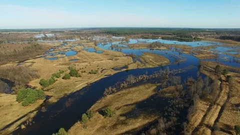 4K. Flight over flooded blue river in early spring, aerial panoramic view. Video stock 85023124