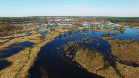 4K. Flight over flooded blue river in early spring, aerial panoramic view. Video stock 85023186