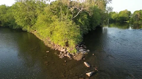 A 4K flight over the Juniata river in Mcveytown Pennsylvania Stock Footage 242511800