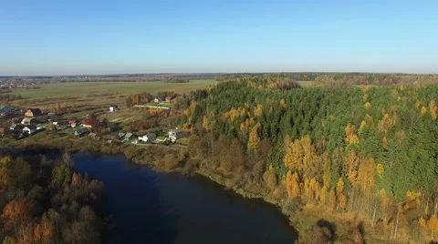 4K. Flight over lake and forest in golden autumn, aerial panoramic view. Stock Footage 59122498