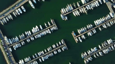 4K. Flight over marina with moored yachts and ships, aerial bird's eye view. 動画素材 78463091
