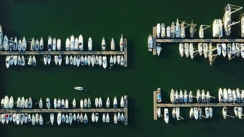 4K. Flight over marina with moored yachts and ships, aerial bird's eye view. 動画素材 78463723