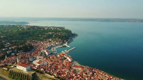 4K. Flight over old city Piran in the morning, aerial panoramic view. Video stock 77983935
