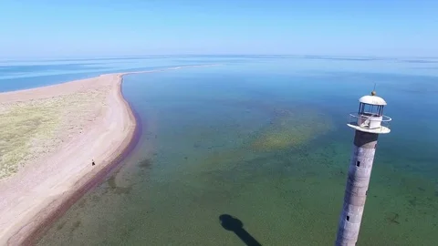 4K. Flight over old lighthouse standing in the sea, aerial view. Estonia. Video stock 72183960