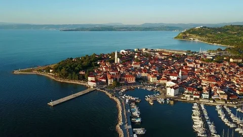 4K. Flight over old town Izola in Slovenia, aerial view with marina at sunset. Video stock 78048205