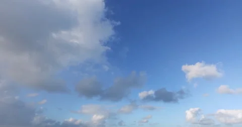 4k Fluffy clouds on a blue sky background Stock Footage 57678932