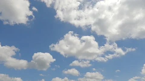 4k Fluffy puffy white cumulus cloud on sunny clear blue sky TimeLapse Stock Footage 195636613