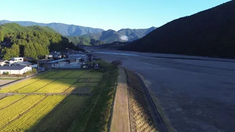 4K Fly Over Large Rocky River in Autumn by Drone Stock Footage 257798006