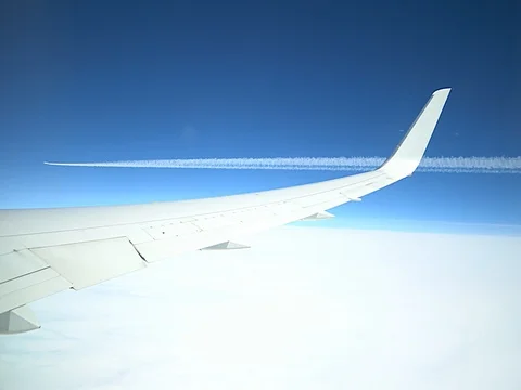 4k flying airplane window and wing Stock Footage 77375474