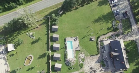 4K Flying away from a small pool Stock Footage 67447773