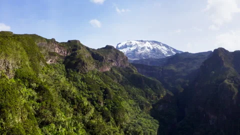 4K Flying UP Drone footage capturing Mount Kilimanjaro and its surrounding valle Stock Footage 330430698