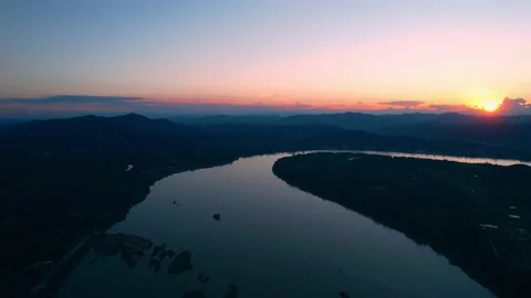 4K flying a drone over a river and wetland area Video stock 165786512