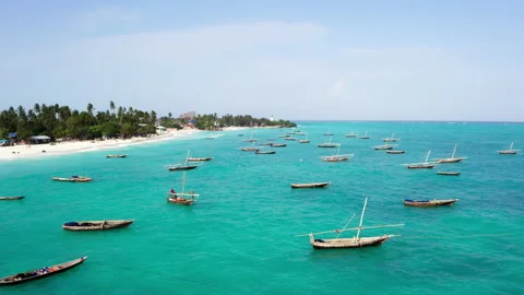 4K Flying Drone view from above turquoise water with white sand and fishing boat 動画素材 221974087