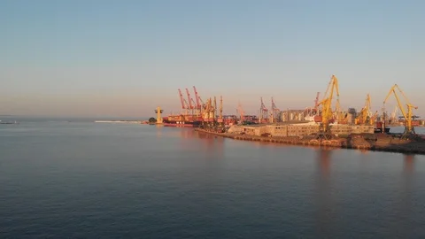 4K Flying low over large commercial shipyard, ships and cranes. Stock Footage 115330369