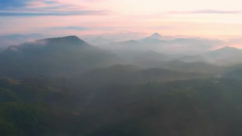 4K Flying through the clouds above mountain tops Stock Footage 165743893