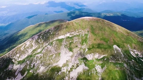 4K Flying towards 6000' mountain Stock Footage 77971482