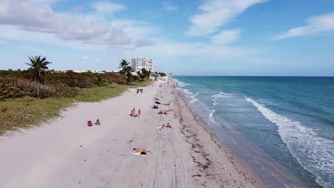 4k flyover shot over Beach in Florida on a sunny day Stock Footage 233939567