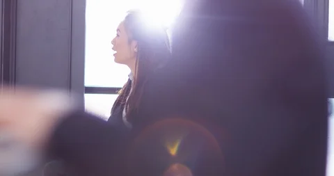 4K Focus pull from background to foreground business people working &amp; in meeting Stock Footage 104121832