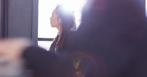 4K Focus pull from background to foreground business people working &amp; in meeting Stock Footage 104578218