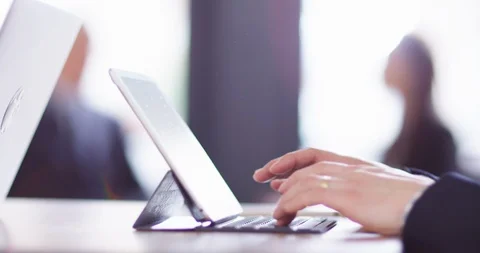 4K Focus pull from foreground to background business people working &amp; in meeting Stock Footage 104578481