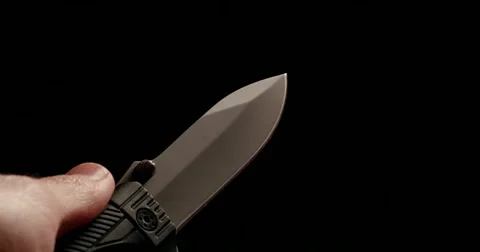 4K - Folding knife in hand Stock Footage 57357115